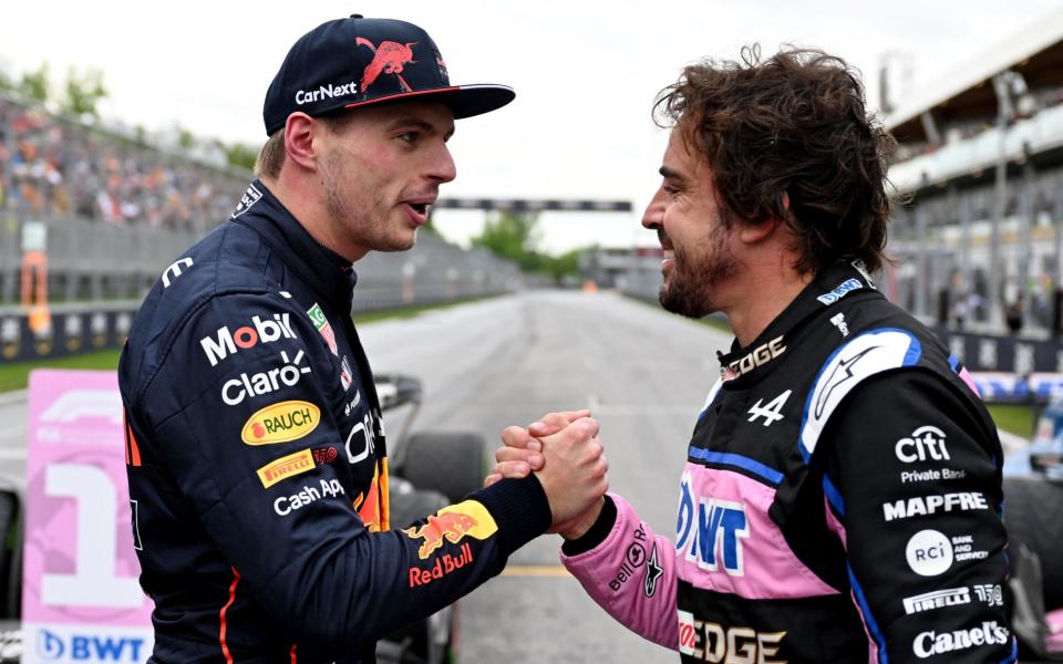 Formula One F1 - Canadian Grand Prix - Circuit Gilles Villeneuve, Montreal, Canada - June 18, 2022 Red Bull's Max Verstappen shakes hands with second placed Alpine's Fernando Alonso after finishing in pole position - Jim Watson/Pool via Reuters