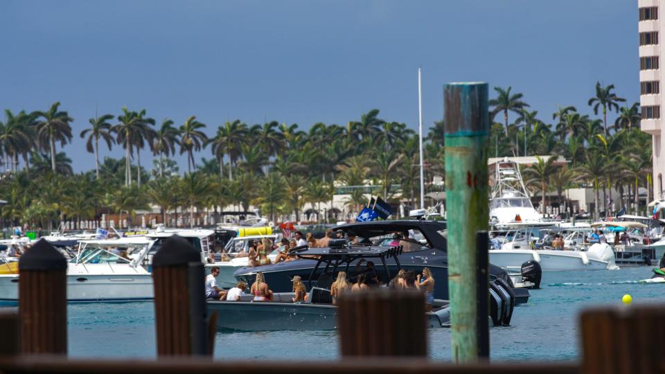 Throngs of people are seen boating, dancing, and drinking during Boca Bash in Lake Boca in Boca Raton on Sunday, April 28, 2024.
