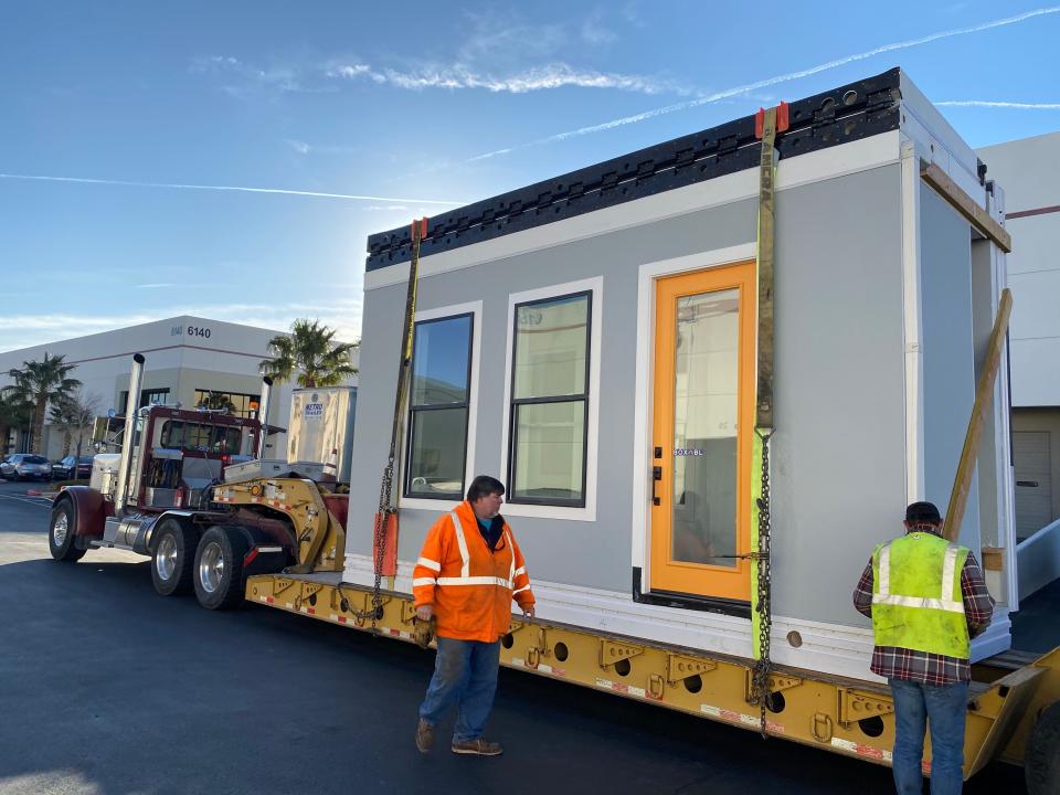 A Casita being moved as its strapped down to a platform