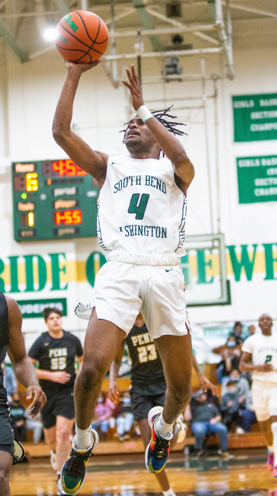 Washington's Marcus Northern (4) shoots during the Penn vs. Washington boys basketball game Friday, Feb. 11, 2022 at Washington High School. 