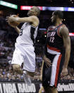 San Antonio Spurs' Tony Parker (9), of France, drives around Portland Trail Blazers' LaMarcus Aldridge (12) to score during the first half of Game 1 of a Western Conference semifinal NBA basketball playoff series, Tuesday, May 6, 2014, in San Antonio. (AP Photo/Eric Gay)