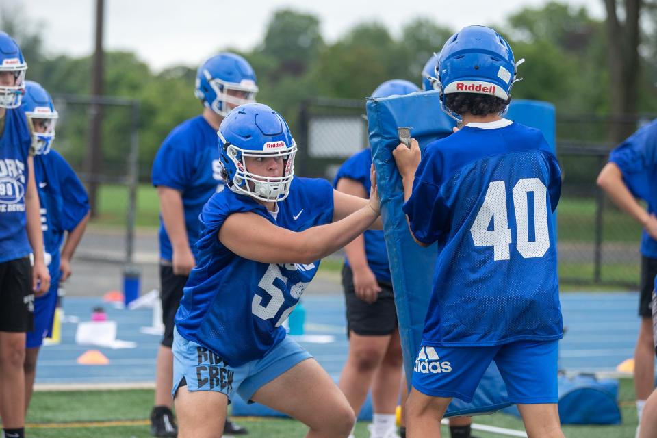 Jake Papera (#52) runs drills with his teammates during Shore Regional High School football practice in West Long Branch, NJ Tuesday, August 8, 2023.