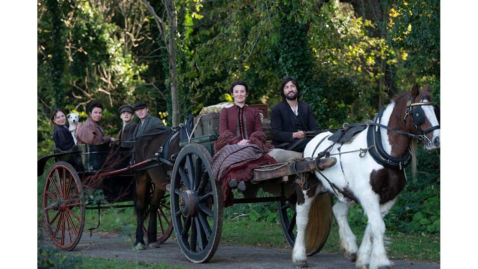 The Hardacre family riding in a carriage