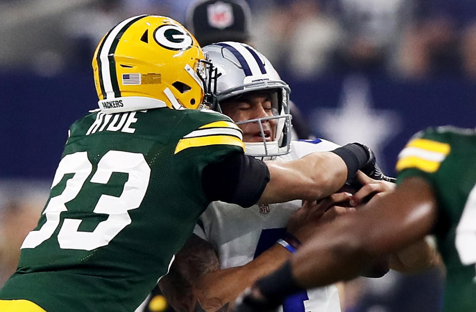 <p>Micah Hyde #33 of the Green Bay Packers sacks Dak Prescott #4 of the Dallas Cowboys in the first half during the NFC Divisional Playoff Game at AT&T Stadium on January 15, 2017 in Arlington, Texas. (Photo by Ezra Shaw/Getty Images) </p>