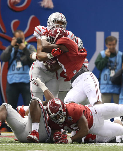 Jan 1, 2015; New Orleans, LA, USA; Ohio State Buckeyes defensive lineman Joey Bosa (97) stops Alabama Crimson Tide running back T.J. Yeldon (4) in the second quarter of the 2015 Sugar Bowl at Mercedes-Benz Superdome. (Chuck Cook-USA TODAY Sports)