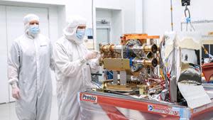 SDL Mechanical Engineer Matt Ralphs and Mechanical Engineering Associate Dave Griffin are shown in this image working on AWE’s Opto-Mechanical Assembly in a cleanroom at SDL facilities on Utah State University's Innovation Campus. Credits: SDL/Allison Bills