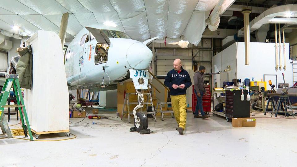 EVAS Air technicians work on turning a Beechcraft 1900D into a new air ambulance.