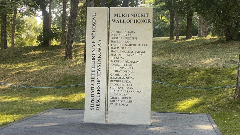 A view of a statue honoring 23 Kosovo Albanians who rescued Jews from the Holocaust during World War II, after an inauguration, in the capital, Pristina, Wednesday, Aug. 23, 2023. The “Wall of Honor” statue was placed in a park in Pristina in the presence of some of the rescuers' descendants, political leaders, and the U.S. and German ambassadors. (AP Photo/Sylejman Kllokoqi)