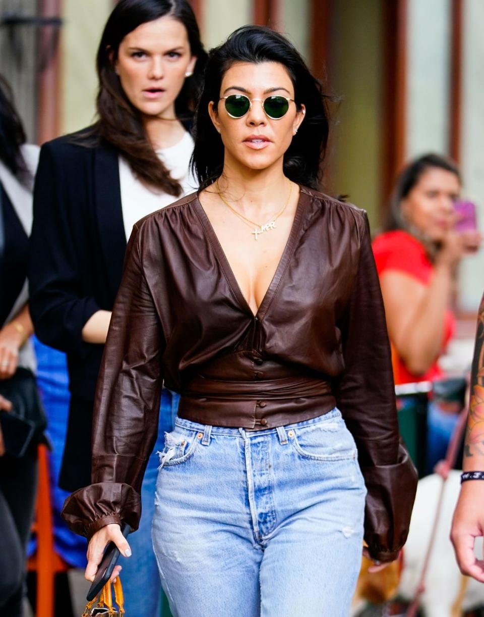 <p>Kourtney Kardashian found a pair of small round glasses that sit in the perfect position for her face shape - right above the cheek, and right below the brow bone.</p>