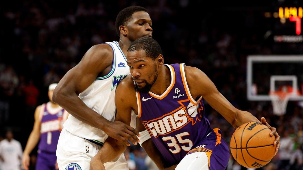 <div>MINNEAPOLIS, MINNESOTA - APRIL 14: Kevin Durant #35 of the Phoenix Suns drives to the basket against Anthony Edwards #5 of the Minnesota Timberwolves in the first quarter at Target Center on April 14, 2024, in Minneapolis, Minnesota.</div> <strong>(Photo by David Berding/Getty Images)</strong>