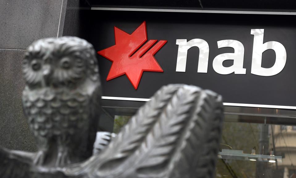 A National Australia Bank (NAB) sign adorns a branch of the bank in Melbourne on May 2, 2019, as the NAB revealed that in the last six months it had put aside 368 million US dollars for "customer-related remediation costs," bringing the total provisions to 770 million. - Australia's big banks -- once among the most profitable in the world -- are being forced to amass war chests worth billions of dollars to reimburse customers for years of dodgy fees. (Photo by William WEST / AFP) (Photo by WILLIAM WEST/AFP via Getty Images)
