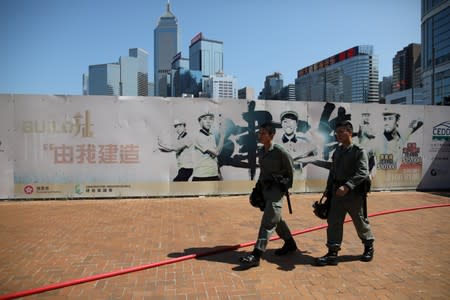 Police officers patrol outside the Legislative Council Complex, in central Hong Kong