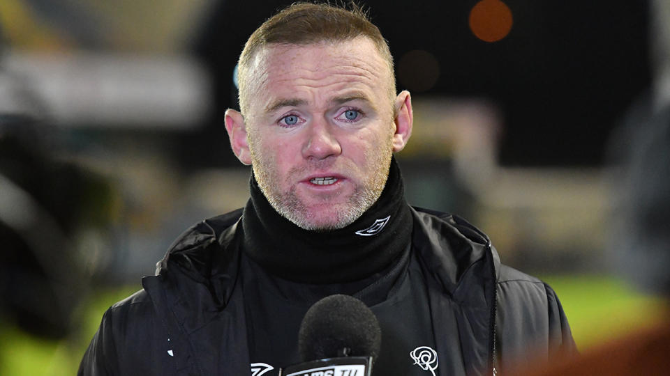 Derby coach Wayne Rooney said it was disappointing that Millwall fans booed both teams for taking a knee at the beginning of their match last weekend. (Photo by MI News/NurPhoto via Getty Images)