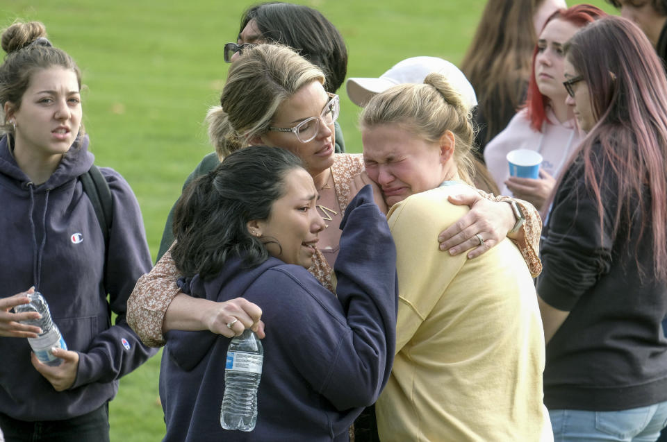 Students are comforted as they wait to be reunited with their parents following the shooting at Saugus High School. (Photo: ASSOCIATED PRESS)