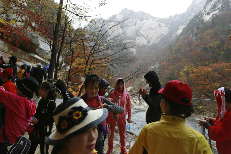 FILE - In this Oct. 23, 2018, file photo, tourists visit Mount Kumgang in North Korea. U.S. President Donald Trump and North Korean leader Kim Jong Un will likely be all smiles as they shake hands later this week in Hanoi for a meeting meant to put flesh on what many critics call their frustratingly vague first summit in Singapore. But behind the grins is a swirl of competing goals and fears. (AP Photo/Dita Alangkara, File)