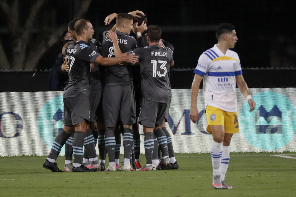 Minnesota United midfielder Robin Lod celebrates his goal as San Jose Earthquakes forward Cristian Espinoza walks off during the first half of an MLS soccer match, Saturday, Aug. 1, 2020, in Kissimmee, Fla. (AP Photo/John Raoux)