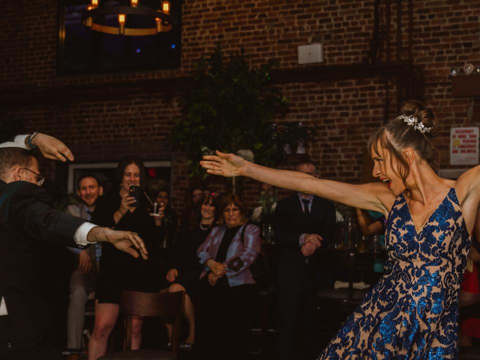 Yossi Rosenberg, left, dancing with his new bride, Ivy Branin, right, at their June 2022 wedding.