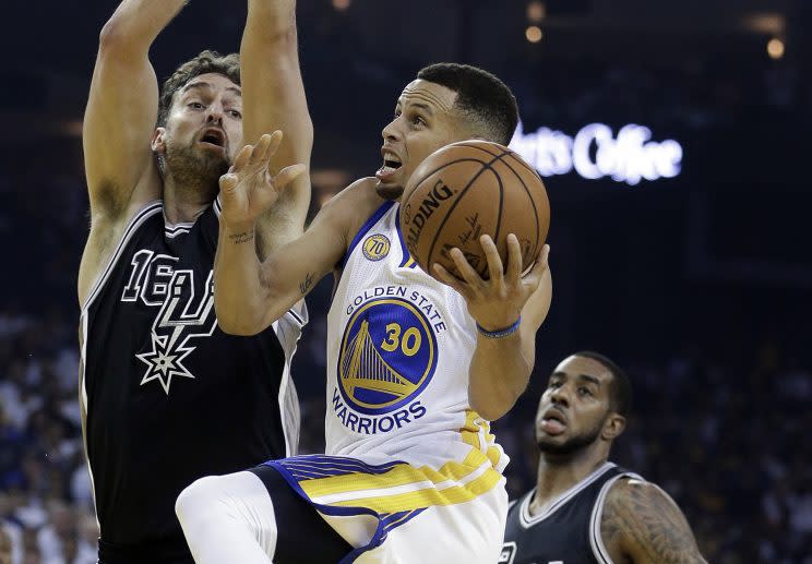 Stephen Curry tries to navigate through San Antonio's trees. (AP)