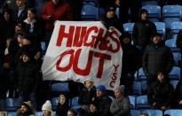 Soccer Football - FA Cup Third Round - Coventry City vs Stoke City - Ricoh Arena, Coventry, Britain - January 6, 2018 Stoke City fans holds up a sign in protest of manager Mark Hughes Action Images via Reuters/Carl Recine