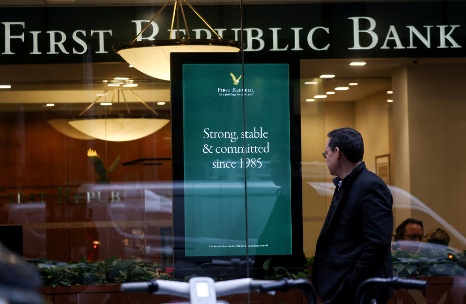 A person walks past a First Republic Bank branch in Midtown Manhattan in New York City, New York, U.S., March 13, 2023. REUTERS/Mike Segar