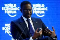 Tidjane Thiam, Chief Executive Officer of Swiss bank Credit Suisse attends the session "The Global Economic Outlook" during the annual meeting of the World Economic Forum (WEF) in Davos, Switzerland January 23, 2016. REUTERS/Ruben Sprich/File Photo