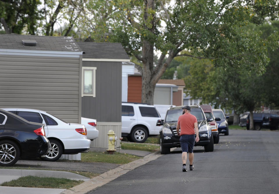 ADVANCE ON THURSDAY, SEPT. 12 FOR USE ANY TIME AFTER 3:01 A.M. SUNDAY SEPT 15 - In this Aug. 30th 2019 photo shows residents of Lamplighter Village, a manufactured and mobile home park, spending time outdoors in their community in Federal Heights, Colo. Across Colorado, where the housing crisis impacts both rural and urban towns, the strife between mobile home park residents and park owners approaches a boiling point. The business model -- in which homeowners pay lot rent to park their houses on someone else's land -- capitalizes on the immobility and economic fragility of tenants who often can't afford to move or live anywhere else.(Kathryn Scott/The Colorado Sun)