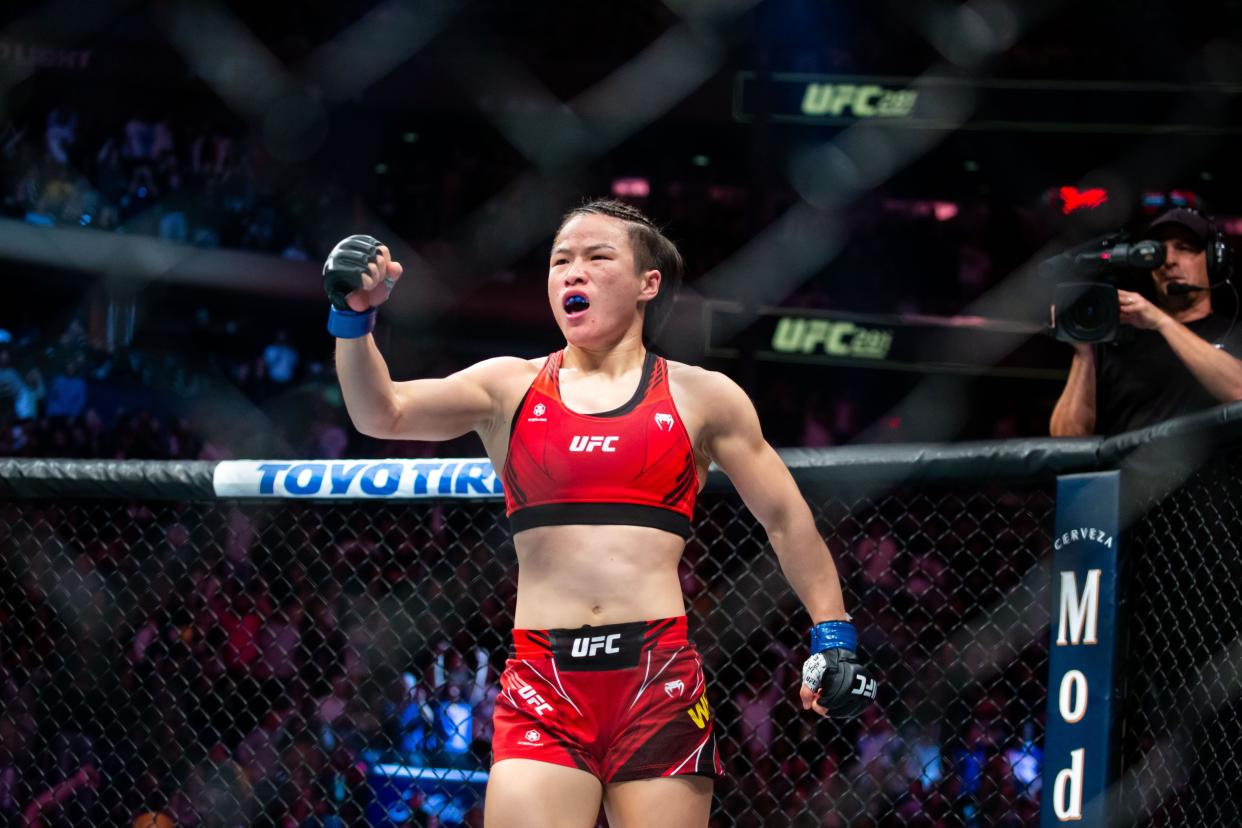 Zhang Weili of China celebrates after winning the women's strawweight title bout against Carla Esparza of the United States at the UFC 281 in Madison Square Garden in New York, the United States, Nov. 12, 2022. China's first UFC champion Zhang Weili reclaimed women's strawweight champion with a second-round submission on Carla Esparza at UFC 281 on Saturday night. (Photo by Michael Nagle/Xinhua via Getty Images)