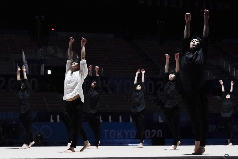 Male rhythmic gymnasts perform before the women's rhythmic gymnastics individual all-around final at the 2020 Summer Olympics, Saturday, Aug. 7, 2021, in Tokyo, Japan. (AP Photo/Ashley Landis)