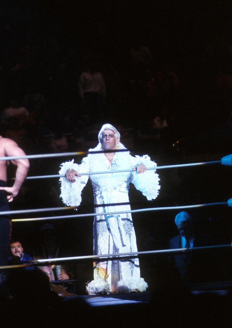 <p>The “Nature Boy” Rick Flair steps into the ring before his Heavy Weight bout against Road Warrior Hawk during the 1988 Bunkhouse Stampede on January 24, 1988 at the Nassau Coliseum in Uniondale, New York. (Photo by B Bennett/Getty Images) </p>