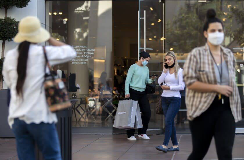 LOS ANGELES, CA - OCTOBER 21: Shoppers exit Nordstrom at The Grove on Thursday, Oct. 21, 2021 in Los Angeles, CA. Shoppers are enjoying the beautiful fall day. (Francine Orr / Los Angeles Times)