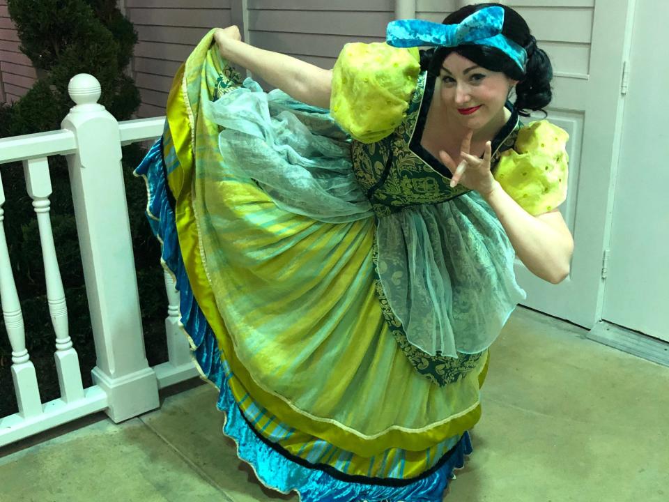 Melaine posing in a Disney costume