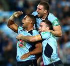 Jennings and the Blues celebrate their 14-0 half-time lead.