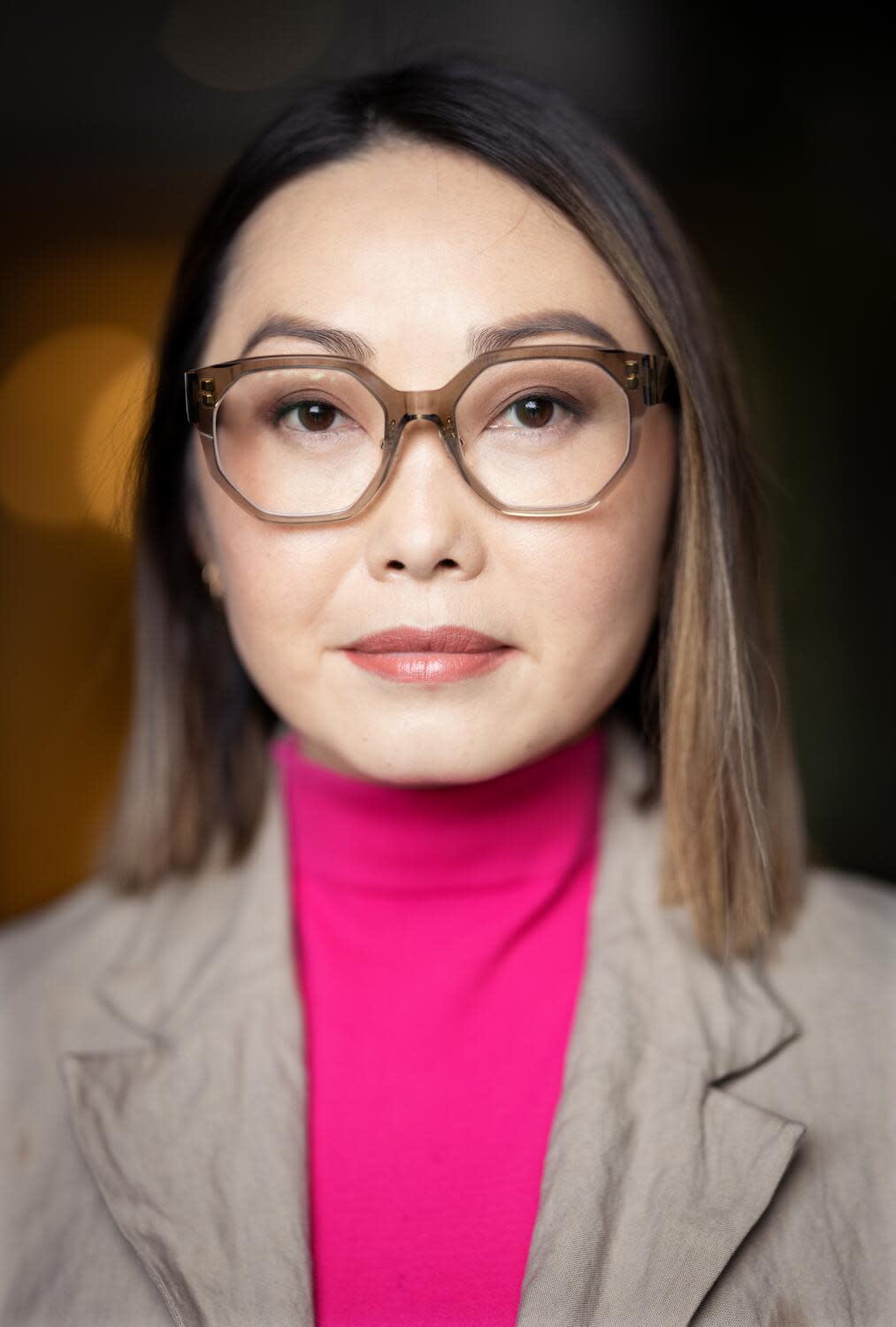 A woman wearing glasses.