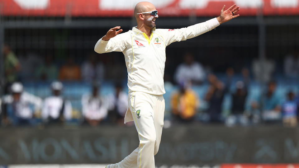 Nathan Lyon celebrates after taking a wicket against India in 2023.