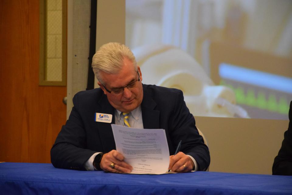 Vice President of Academic Affairs Administration Stephen Strom signs a formal agreement between NCMC and Davenport University allowing nursing graduates to have easily-transferrable credits.