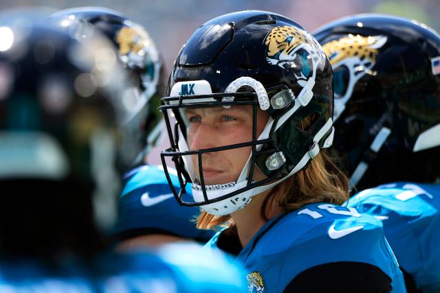 Jacksonville Jaguars quarterback Trevor Lawrence (16) looks for a