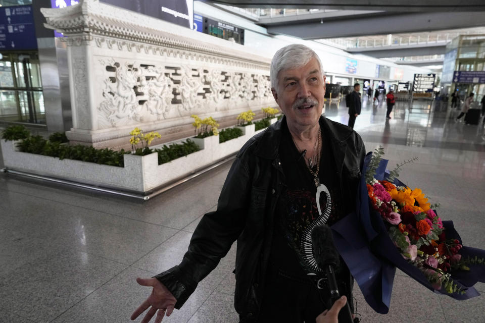 Philadelphia Orchestra's 73-year-old violinist Davyd Booth speaks upon arriving at the Beijing Capital International Airport on Tuesday, Nov. 7, 2023. Musicians from the Philadelphia Orchestra arrived in Beijing on Tuesday, launching a tour commemorating its historic performance in China half a century ago in signs of improving bilateral ties ahead of a highly anticipated meeting between President Joe Biden and Xi Jinping. (AP Photo/Ng Han Guan)
