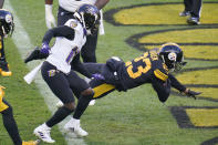 Pittsburgh Steelers cornerback Joe Haden (23) dives into the end zone with a touchdown in front of Baltimore Ravens wide receiver Marquise Brown (15) after making an interception in the first halfduring an NFL football game, Wednesday, Dec. 2, 2020, in Pittsburgh. (AP Photo/Gene J. Puskar)