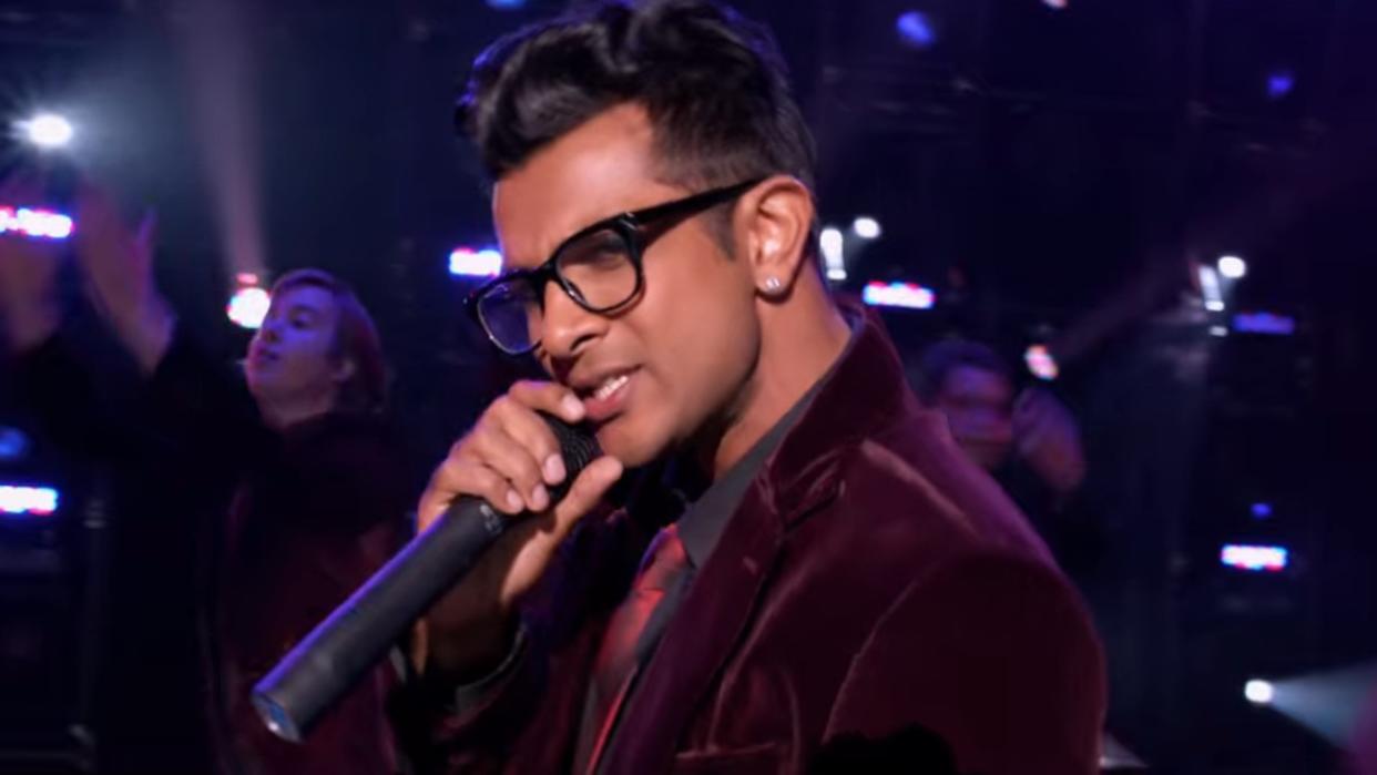  Utkarsh Ambudkar rapping in the Trebelmakers final performance in Pitch Perfect. 