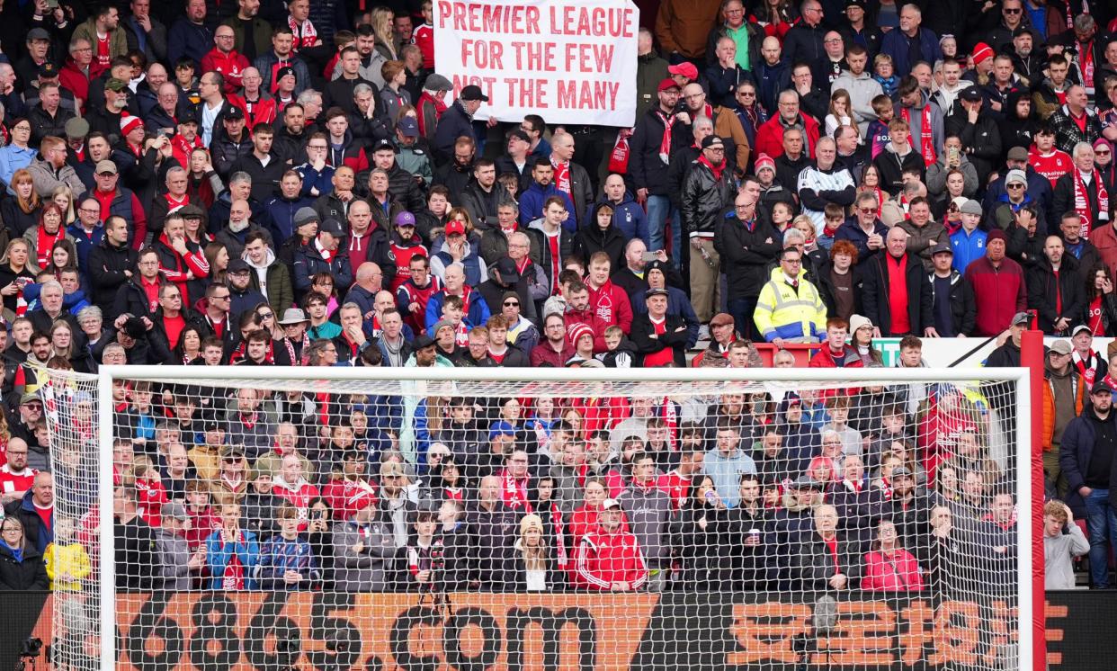 <span>A banner in the game against Manchester City sums up some Forest fans’ views on their treatment by the Premier League.</span><span>Photograph: Mike Egerton/PA</span>