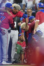 Puerto Rico pitcher Edwin Diaz is helped into a wheelchair after he appeared to injure himself during postgame celebration after Puerto Rico beat the Dominican Republic 5-2 during a World Baseball Classic game, Wednesday, March 15, 2023, in Miami. (AP Photo/Wilfredo Lee)