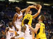 Nov 27, 2018; Phoenix, AZ, USA; Indiana Pacers forward Bojan Bogdanovic (44) is fouled by Phoenix Suns forward TJ Warren in the fourth quarter at Talking Stick Resort Arena. Mandatory Credit: Mark J. Rebilas-USA TODAY Sports