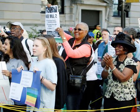 Members of the black community join a diverse crowd of protesters opposing North Carolina's HB2 "bathroom law" that restricts members of the LGBT community from using the bathroom of their choice, during a demonstration outside the state legislature in Raleigh, North Carolina on May 16, 2016. REUTERS/Jonathan Drake