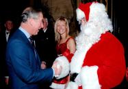 <p>Prince Charles greets Santa and his helper at the 'Not Forgotten Association' reception at St James's Palace.</p>