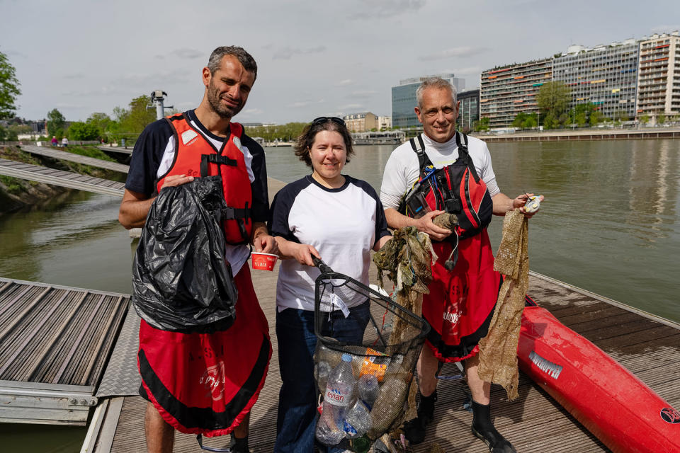 Kayakers Paul Maakad, Sarah Birden and Vincent Darnet with the trash they collected from the Seine River. (Joel Lawrence / NBC News)
