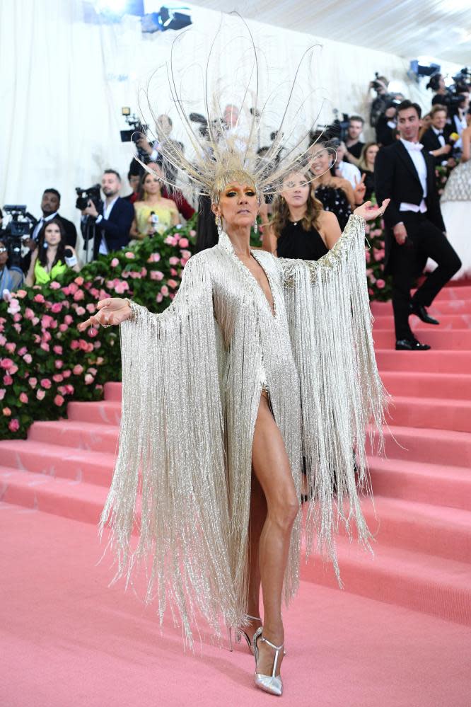 Dion in champagne-toned Oscar de la Renta with fringing and peacock feathers at the 2019 Met Gala