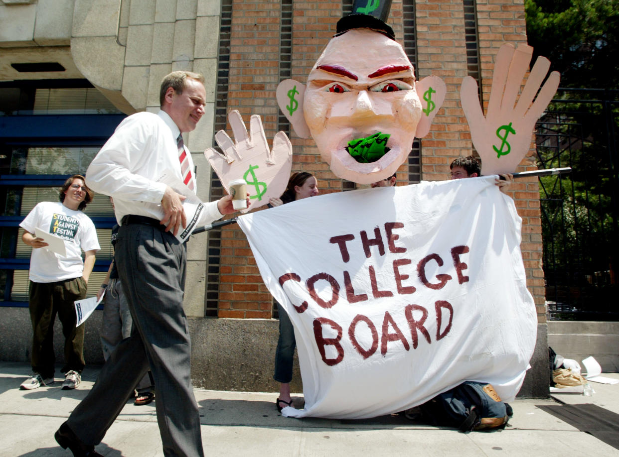 NEW YORK - JUNE 27:  Students protest SAT testing outside College Board headquarters June 27, 2002 in New York City. College Board trustees decided June 27 to add a written essay and other changes to the SAT in an overhaul of the college entrance exam. The first administration of the new SAT will occur in March of 2005. (Photo by Mario Tama/Getty Images)