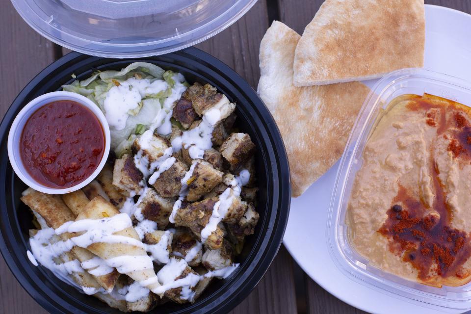 Chicken over rice along with hummus and pita from the Koshary King food truck on the corner of Summit and Hudson.