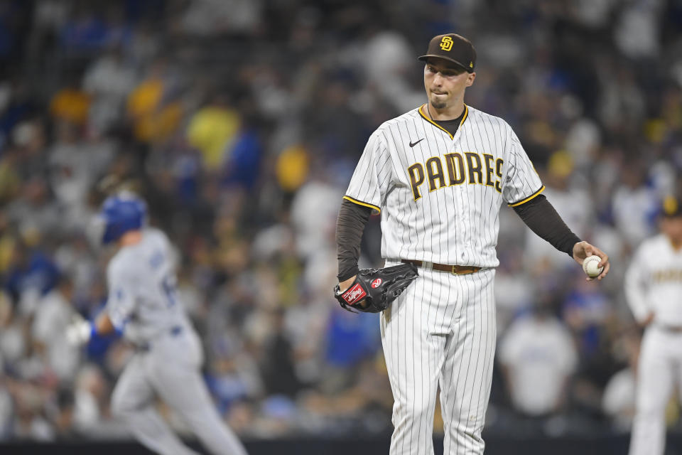 Blake Snell of the San Diego Padres stands on the mound after giving up a solo home run to Dodgers catcher Will Smith. (Photo by Denis Poroy/Getty Images)