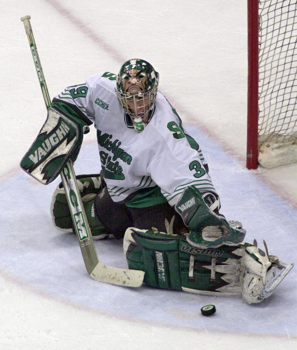 Goalie Ryan Miller blocks a shot during his playing days at Michigan State University.